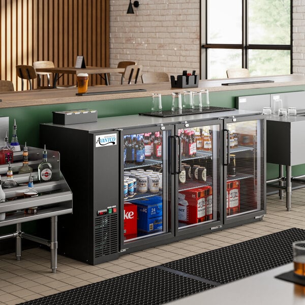 An Avantco back bar refrigerator with drinks on a shelf.