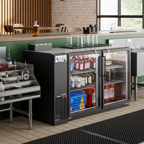 An Avantco UBB-60-GT-G back bar refrigerator with drinks and bottles inside.
