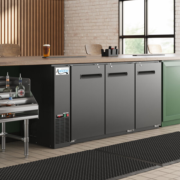 An Avantco black back bar refrigerator on a galvanized counter.