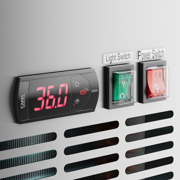 A close-up of a red switch with white numbers on a digital display.