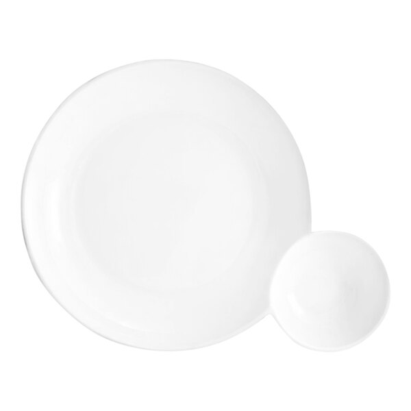 A bright white round porcelain bowl with two compartments, one large and one small, designed for serving food.