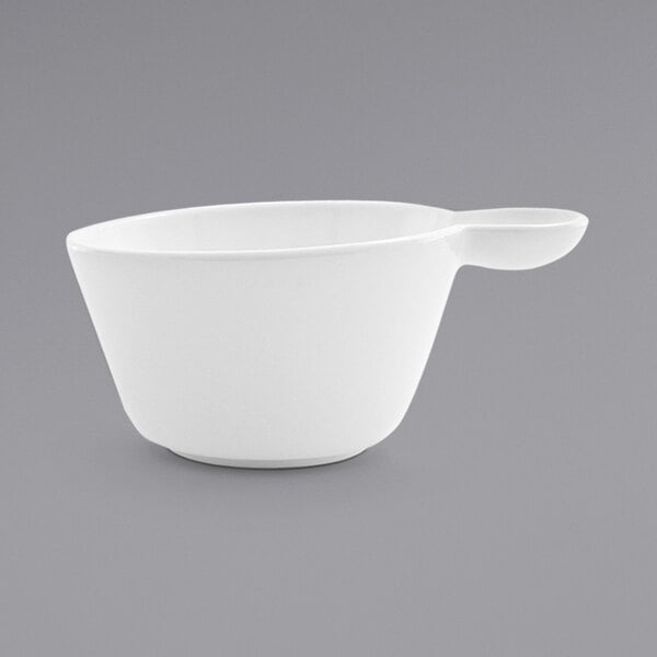 A white porcelain cup with a handle.
