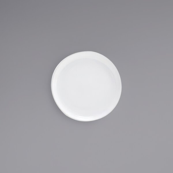 A Front of the House Harmony bright white porcelain coupe plate.