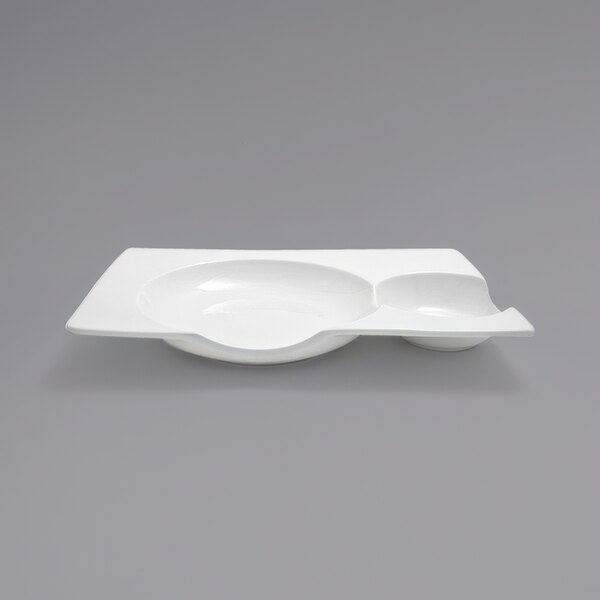 A white rectangular porcelain plate with two sections.