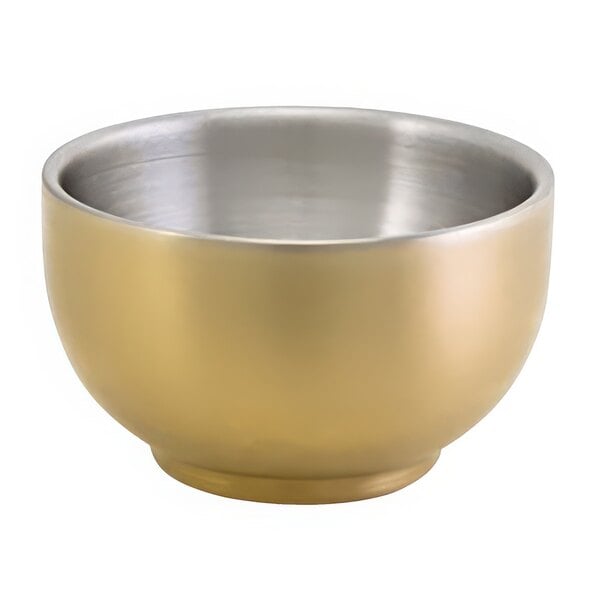 A matte brass brushed stainless steel ramekin with a gold interior and silver rim.