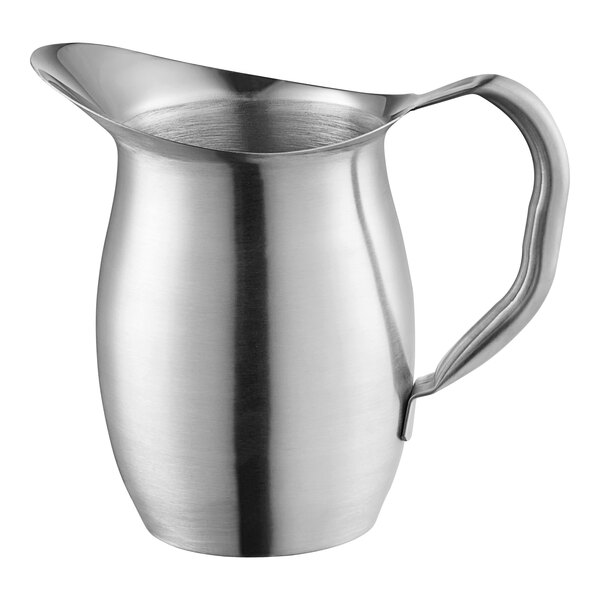 A Vollrath stainless steel bell pitcher with a handle.