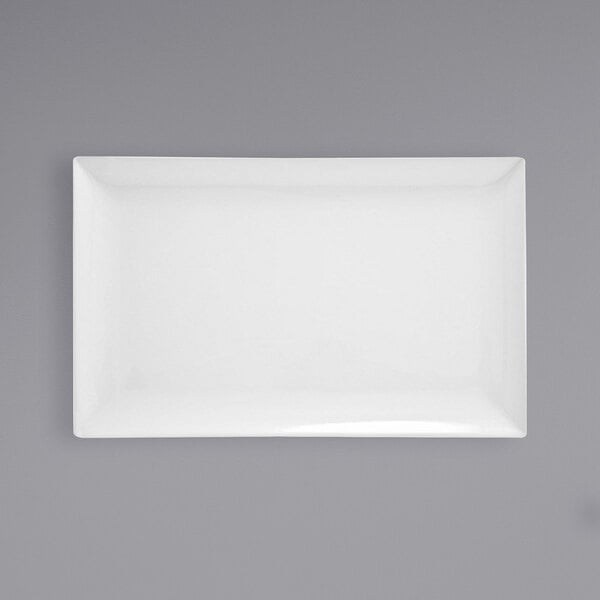 A white rectangular porcelain platter with a gray border.