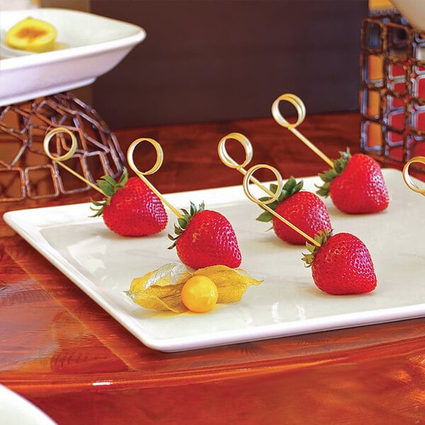 A plate of strawberries on a Front of the House bright white square porcelain plate.