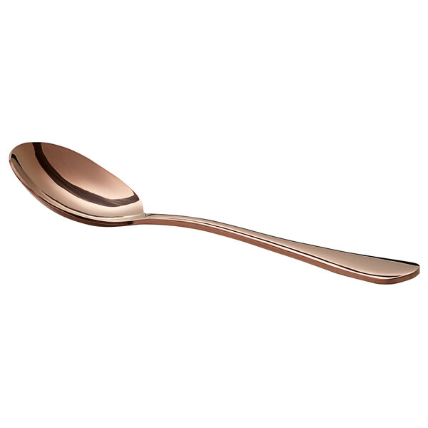 A close-up of an Acopa Vernon rose gold bouillon spoon with a white background.
