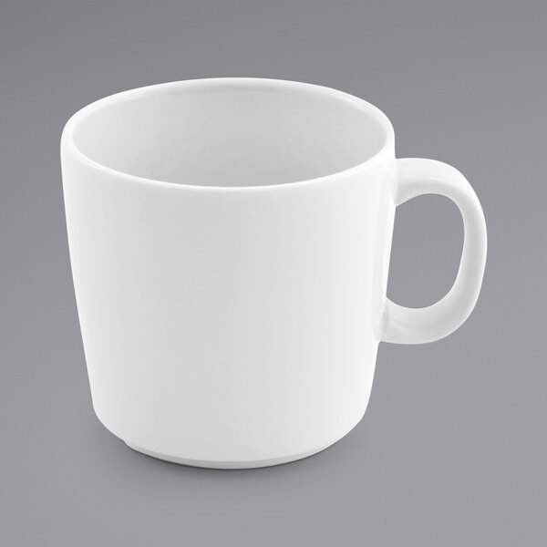 A white porcelain cup with a handle.