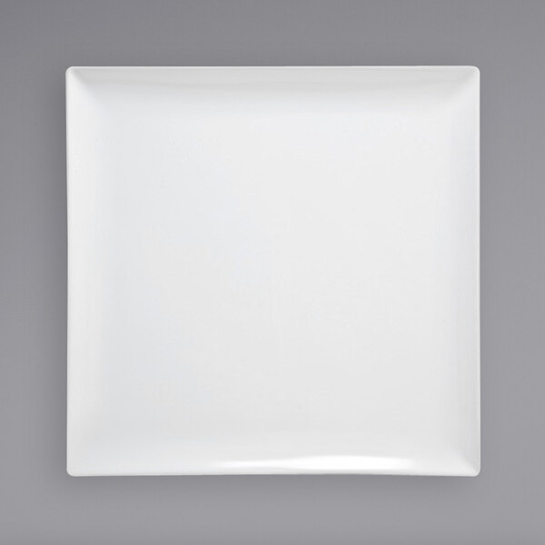 A Front of the House bright white square porcelain platter on a grey background.