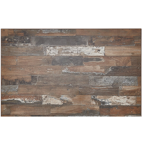 A rectangular wood table top made of planked pine with white and brown paint.