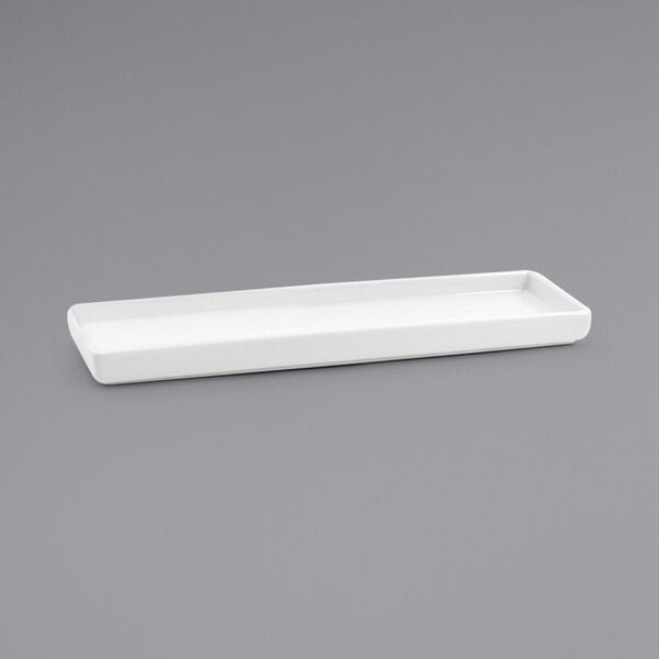 a white rectangular plate on a gray background