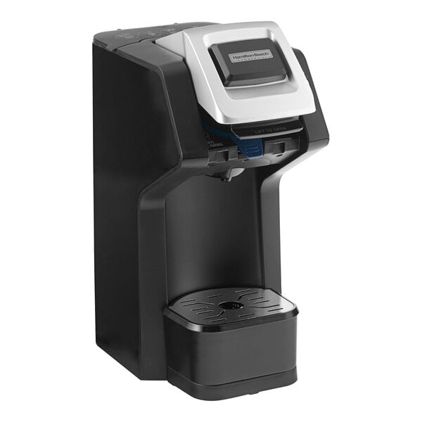A black and silver Hamilton Beach single cup coffee maker with a cup holder.