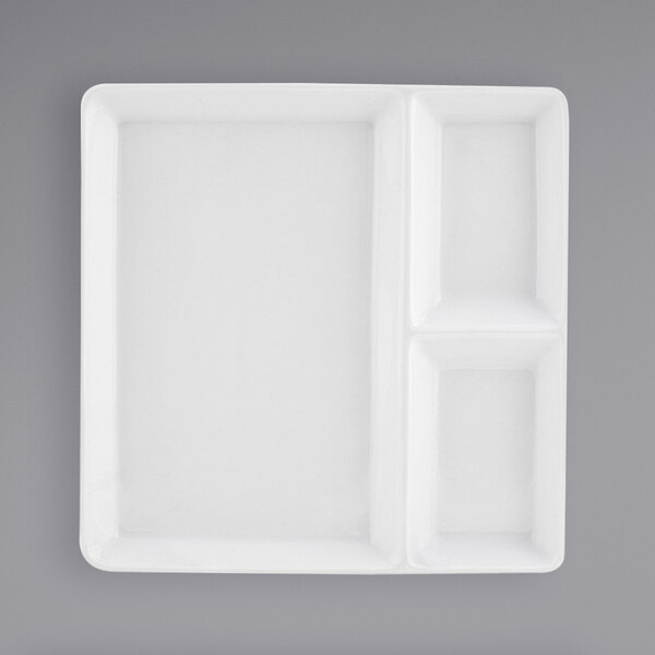 A white rectangular plate with three compartments.