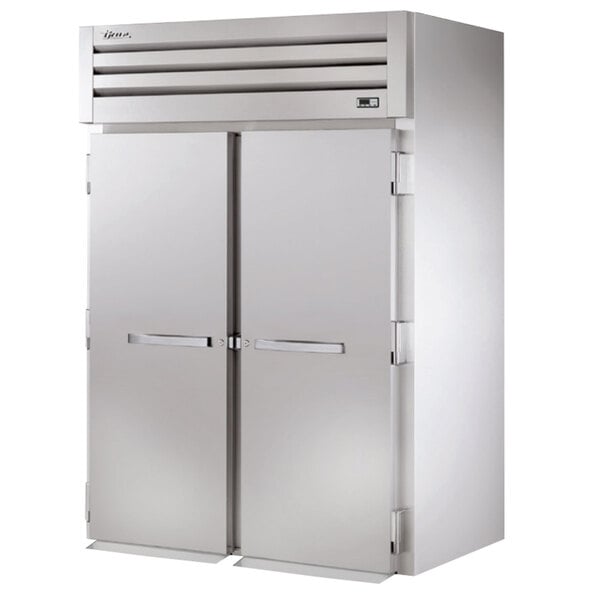 A white True roll-in holding cabinet with two solid doors.