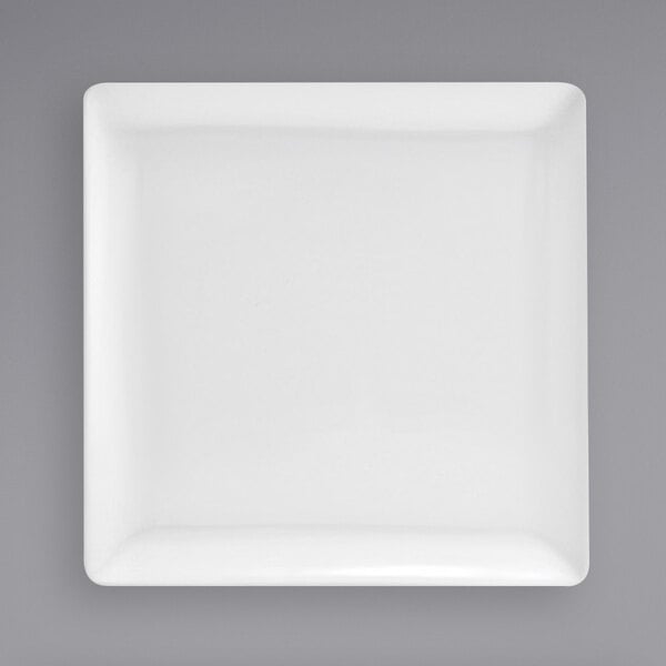 A Front of the House bright white square porcelain plate on a white background.