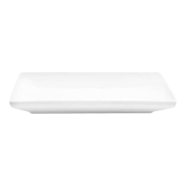 A small, bright white square porcelain plate.