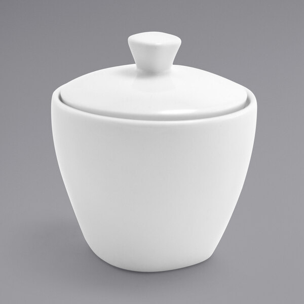 A white ceramic container with a lid.