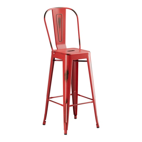 A Lancaster Table & Seating red metal bar stool with a seat.