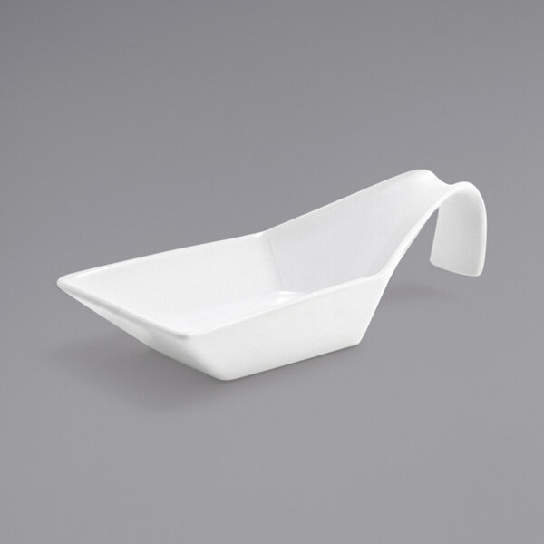 A bright white porcelain spoon with a curved handle.