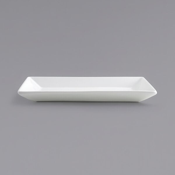 A close up of a Front of the House Kyoto rectangular porcelain plate on a gray background.