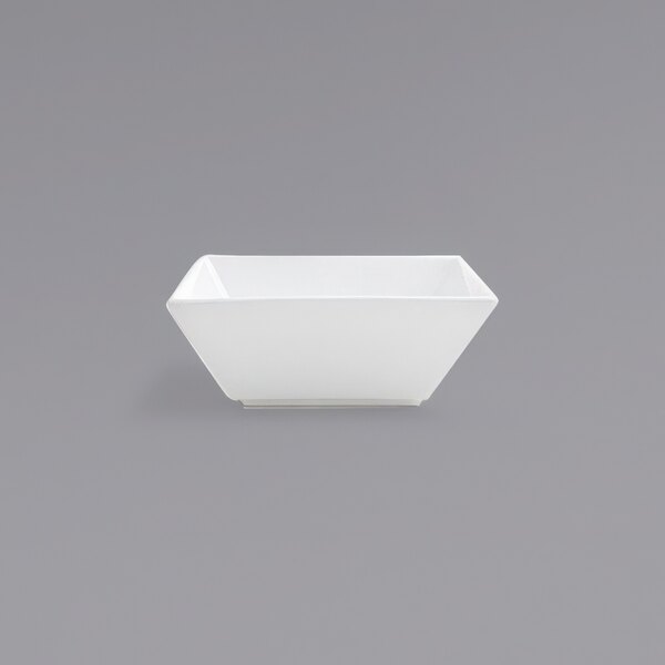 A white square bowl on a gray background.