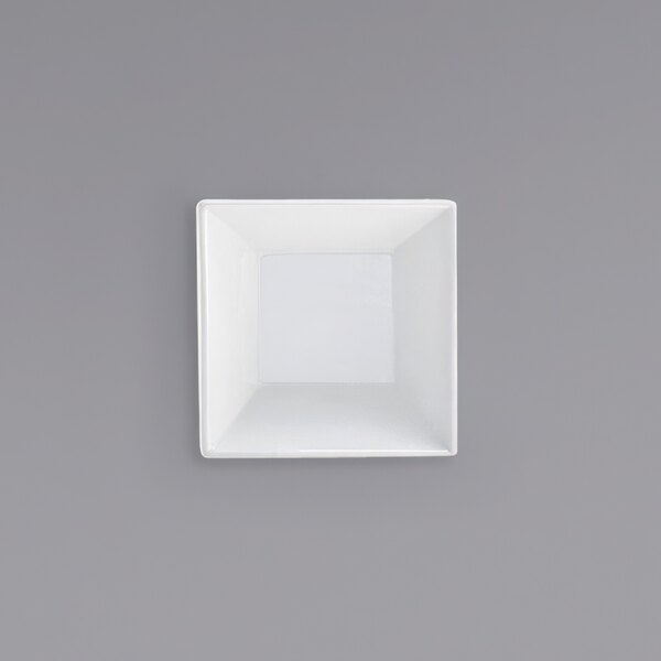A white square bowl on a gray background.