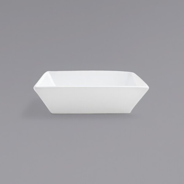 A white rectangular bowl on a gray background.