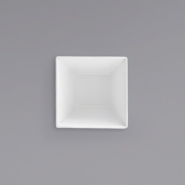 A white square bowl on a gray background.