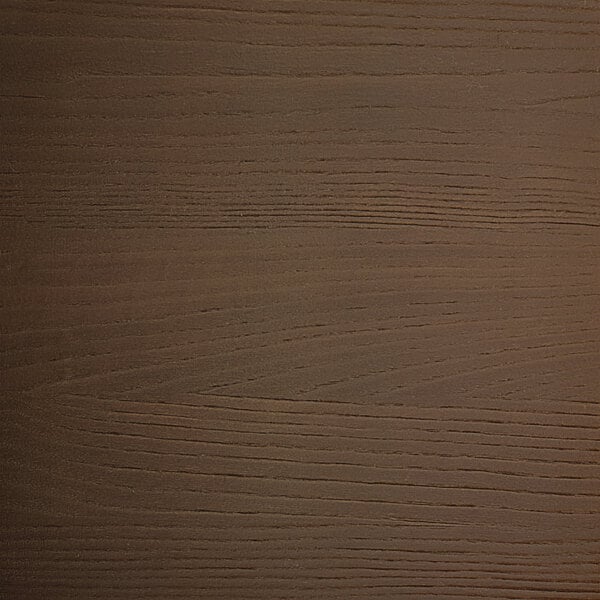 A close up of a Lancaster Table & Seating walnut wood seat with scratches.