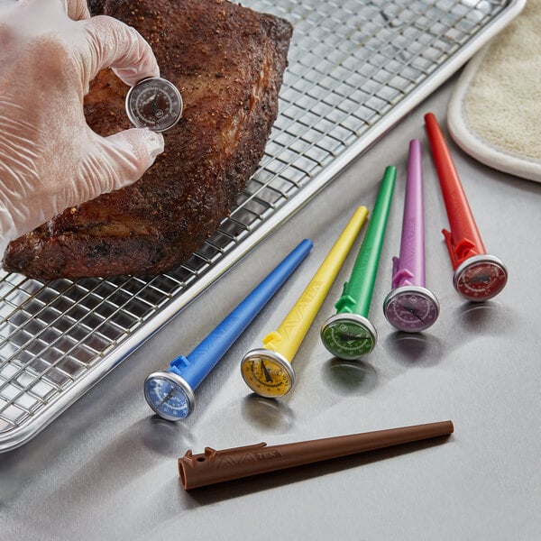 A set of six pocket probe dial thermometers with colored handles, used for measuring food temperature.