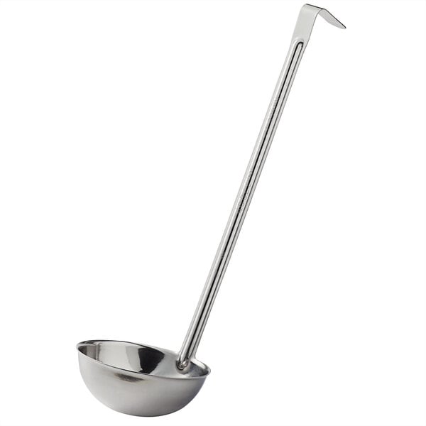 A silver ladle with a long handle.