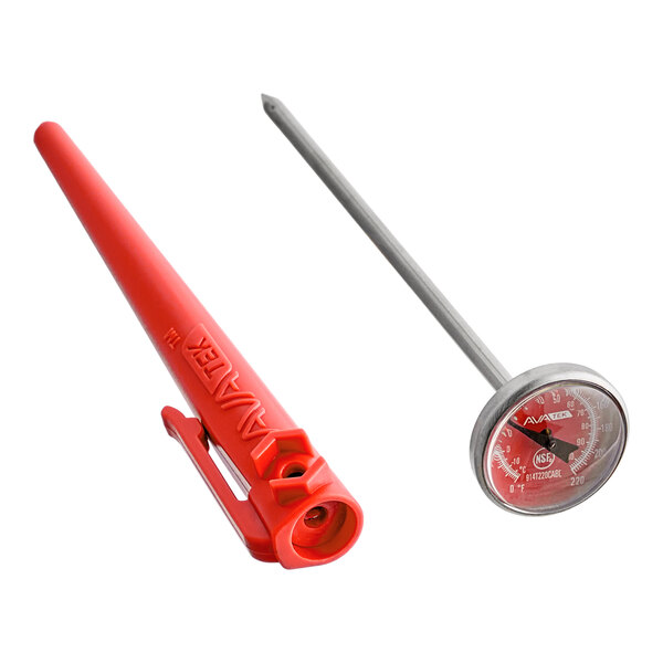 A red dial probe thermometer with a protective sheath and calibration wrench for measuring raw meat temperatures.
