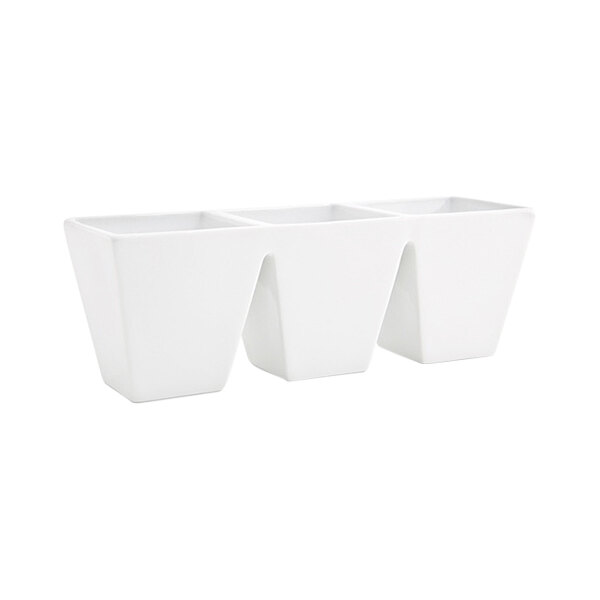 A white porcelain bowl with three separate compartments.