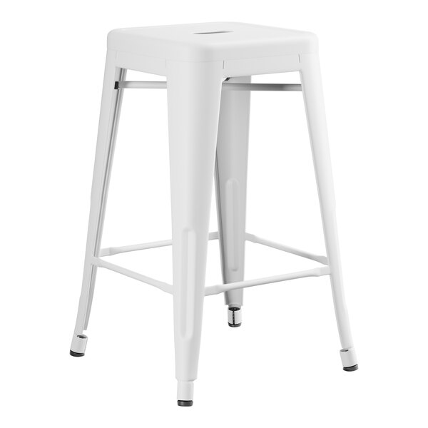 A white metal Lancaster Table & Seating outdoor backless counter height stool.