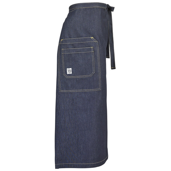 A blue denim Mercer Culinary bistro apron with pockets.