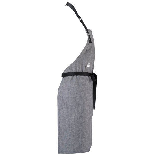 A gray Mercer Culinary bib apron with black webbing.