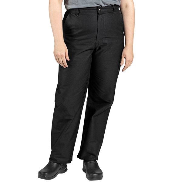 A person wearing Uncommon Chef black chef pants.