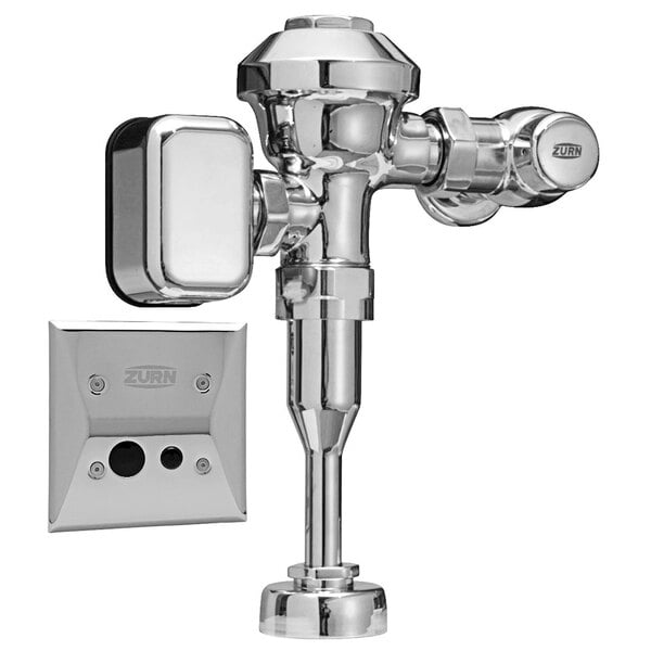 A Zurn chrome urinal flush valve on a wall.