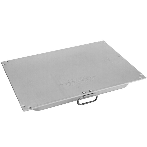 A metal plate with a handle on it.