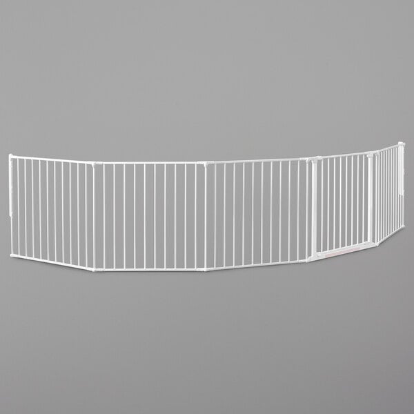 A white BabyDan safety gate with a metal bar.