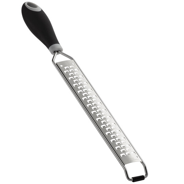 A close-up of a Mercer Culinary stainless steel grater with a black Santoprene handle.