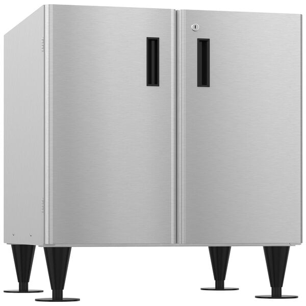 a silver refrigerator with black handles