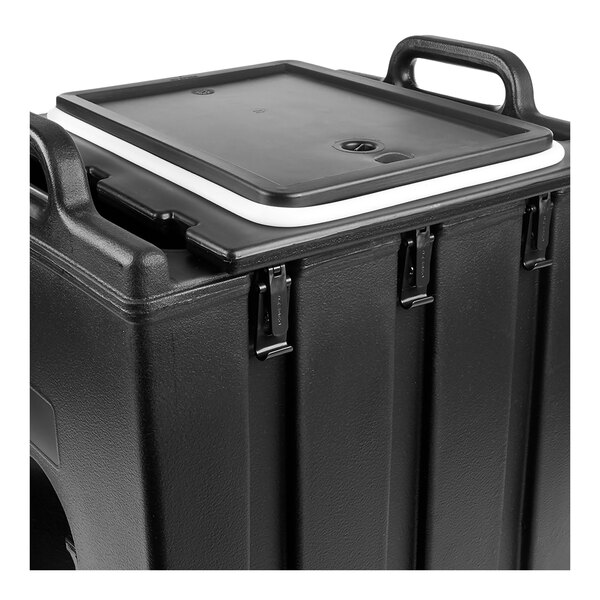 A close-up view of a black container with a rectangular lid, featuring handles and metal latches.