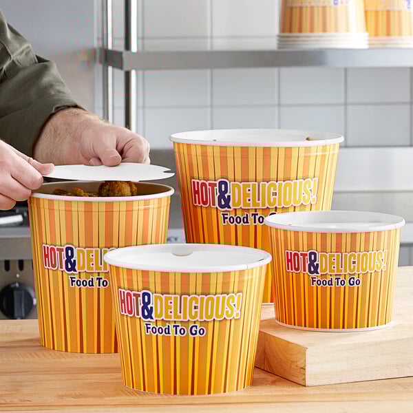 A man using a Choice hot food bucket to put food into a container.