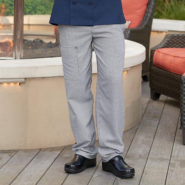 A person wearing Uncommon Chef houndstooth cargo pants.