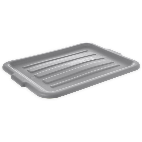 A gray plastic Carlisle bus tub lid with a handle.