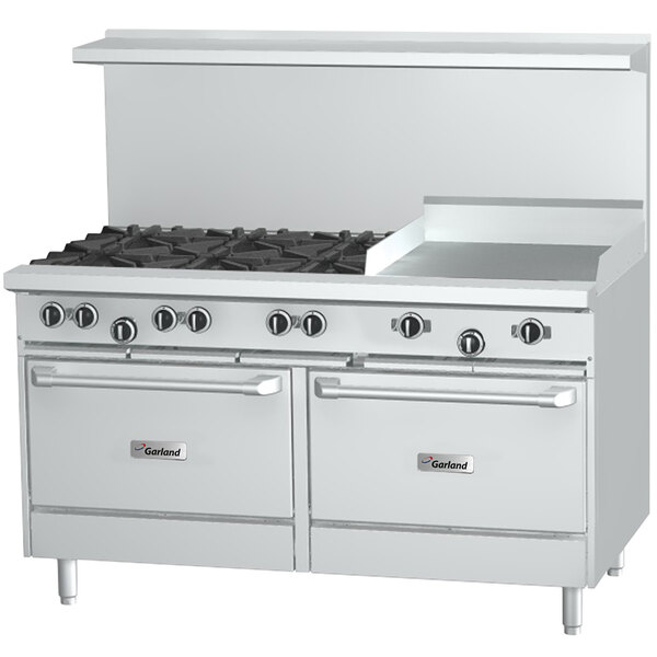 A stainless steel Garland commercial gas range on a counter with 8 burners, a griddle, and 2 ovens.