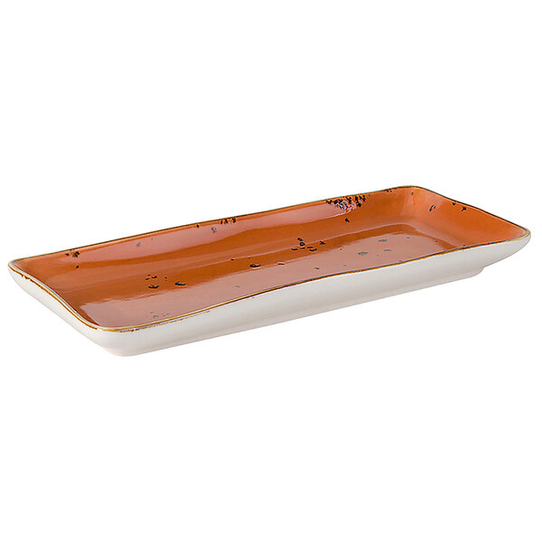 A rectangular orange and white Tuxton China tray with a Geode design.